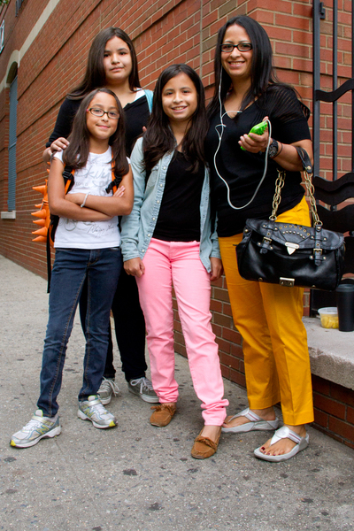 Adela Villaneueva, 36, (far right) takes her daughter Katie, 10, (far left) to the first day of school September 6, 2012 at P.S. 234 in TriBeCa. Villaneueva said that getting her daughters Katie, Mackenzie (center) and Juliana (back) ready for school leaves little time for her to think about fashion.