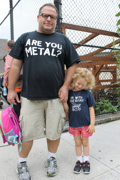 Richard Ryea, a dad at Park Slope's P.S. 321, showed off his family's rock 'n' roll sensibility with an metal-themed T-shirt while daughter Lennon, 4, sported an "I'm with the band" T-shirt. Ryea, who has worked in the music business, was there to drop off his older daughter, McCartney, 9.