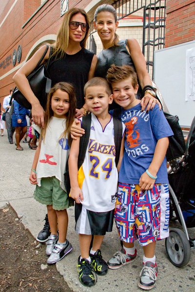 Lori Morgen, 41, (right and back) takes her son Jagger, 7, (far right) to his first day of school September 6, 2012 at P.S. 234 in TriBeCa. 