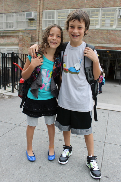 Lux Einstein, 7, and brother Izzy Einstein, 9, at Park Slope's P.S. 321. Izzy said the goal of his back-to-school outfit was to show off his comic side, so he chose a T-shirt showing eggs in bumper cars. Izzy was also wearing brand new Nike 6.0s. Lux's mini skirt with attached leggings came from Target. 