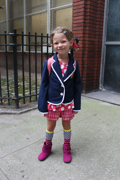Scarlett, 6, loves colors and picked out her first day of school outfit herself. Her bright pink backpack offered another burst of color in keeping with the neon trend that's still going strong this fall. On her blazer was a patch sewed on by her mom from Hogwart's School — she was headed into P.S. 87. 