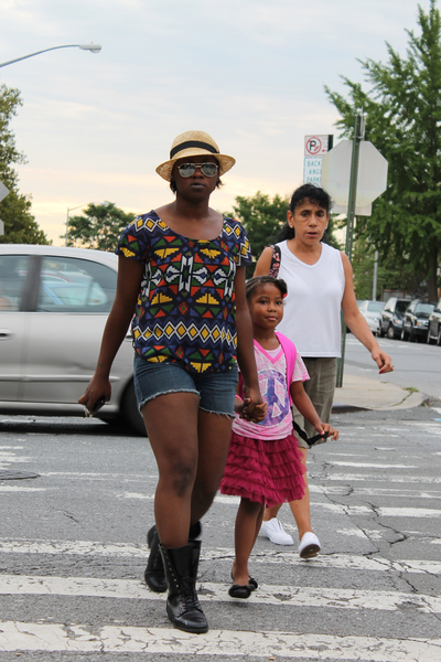Zee Hill, left, walks to the Summit Academy in Red Hook with her 5-year-old daughter, Z'yanah Gonzalez, and Gonzalez's grandmother, Virgenmina Pagan. Hill was wearing H&M clothes and Bakers Boots. Asked how she'd describe her outfit, she replied, with a laugh, 