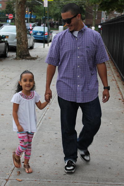 Danny Morales walks his 4-year-old daughter, Skylene, to P.S. 15 in Red Hook. Morales wore a Chap's button-down shirt, Levi's jeans and sunglasses.