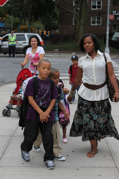 Lucretia Jones walks her children to school at P.S. 15 in Red Hook. She was wearing Liz Claiborne and Ann Taylor, which she described as 