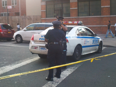 A bodega worker was shot and killed as he tried to escape armed robbers.
