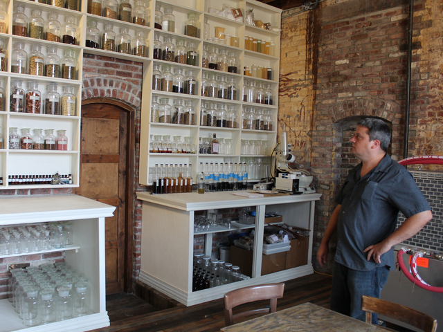 Cacao Prieto sales director Alex Clark stands in the distillery's apothecary in Red Hook.