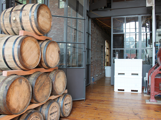 Stacked casks sit on the factory floor at Cacao Prieto in Red Hook.
