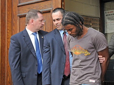Shooting suspect Christopher Dorsey, far right, leaves the 42nd Precinct in The Bronx.