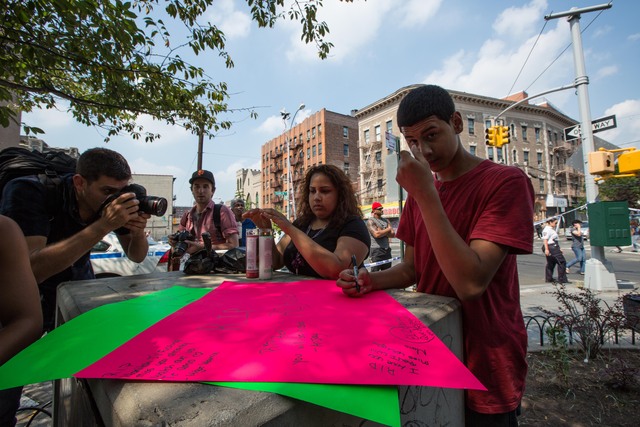 Jose, 14, a friend of Reynaldo Cuevas, wrote his tribute for the makeshift memorial on September 7, 2012, the day Reynaldo Cuevas was killed when a cop's weapon discharged during a robbery.