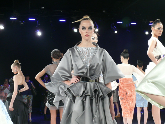 Cennamo's gray origami cocktail dress with gunmetal belt.