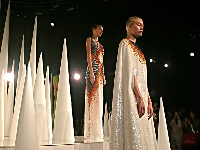 Mirano's rainbow sequined sheer organza gown and white sequined cape with rainbow yoke.