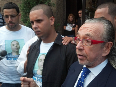 Joel Cuevas (center), Reynaldo's brother, stands next to Sanford Rubenstein (right), the family’s attorney.