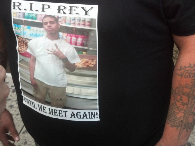 Many mourners wore t-shirts with photos of Reynaldo Cuevas to his memorial service.