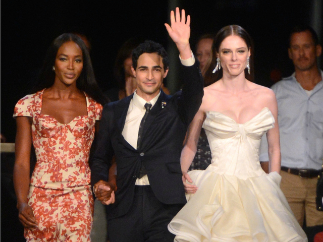 Naomi Campbell, designer Zac Posen, and Coco Rocha walk the runway at the Zac Posen Spring 2013 fashion show during Mercedes-Benz Fashion Week on Sept. 9, 2012. An argument between three French fashionistas and a PR executive broke out at the show over seats. 