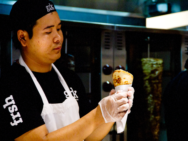 A chef at GRK Fresh Greek, a new eatery in the Financial District, makes a pita. 