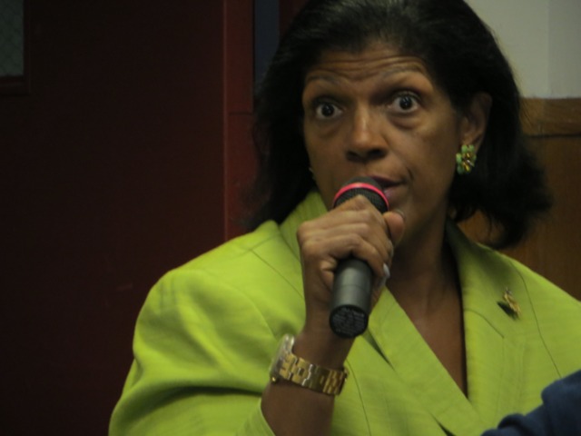 Community Board Chair Pamela Palenque explains liquor license renewal process at a meeting to discuss the issues on Dyckman Street on Sept. 12, 2012. 