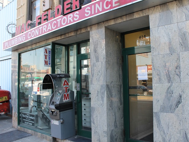 The Mac Felder Plumbing storefront features a full-sized bathroom.