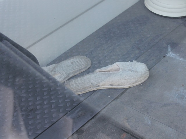 Discarded slippers at the 