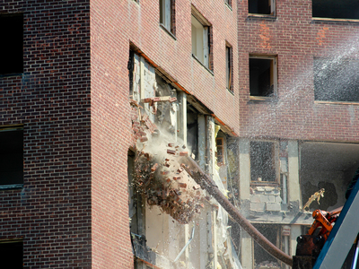 <p>Bulldozers bring down a seven story building Thursday, Sept. 13, 2012, the first of four high rises that will be demolished over the next several months.</p>
