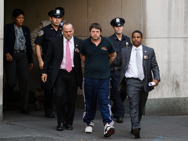 <p>David Albert Mitchell, 42, is led from Special Victims Unit in Harlem after being charged with the rape of a 73-year-old birdwatcher in Central Park on Sept. 12th, 2012.</p>
