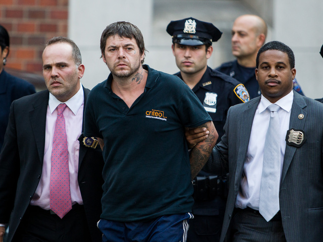 <p>David Albert Mitchell, 42, is led from Special Victims Unit in Harlem after being charged with the rape of a 73-year-old birdwatcher in Central Park on Sept. 12th, 2012.</p>
