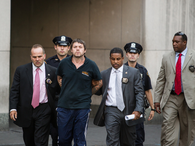 <p>David Albert Mitchell, 42, is led from Special Victims Unit in Harlem after being charged with the rape of a 73-year-old birdwatcher in Central Park on Sept. 12th, 2012.</p>
