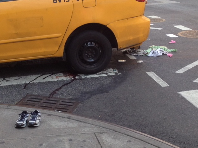 The aftermath of an accident at East 69th Street and First Avenue. A taxi minivan struck and killed a 65-year-old Queens woman on Sept. 17, 2012.