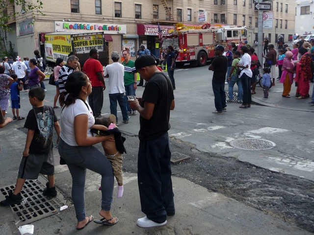 A crowd gathered at the scene Monday afternoon. Neighbors said the street was normally teeming with children attending the medical clinic and those coming from a nearby elementary school, which was fortunately closed yesterday for Rosh Hashanah, the Jewish New Year. 