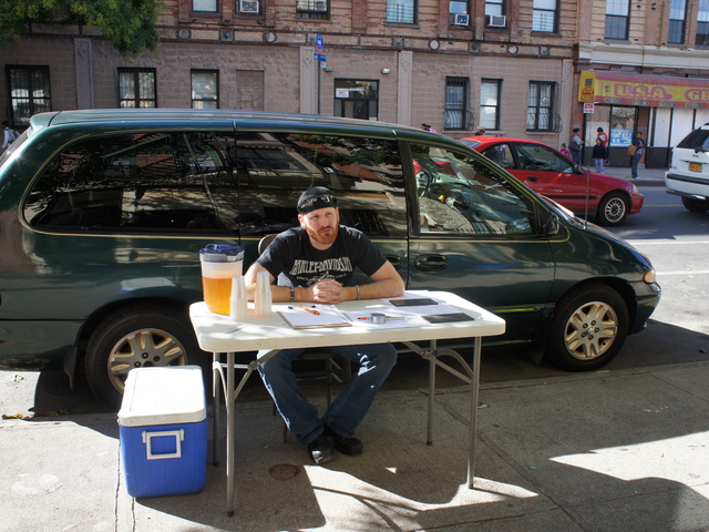 <p>Luke Wheeler waits with a petition in support of Catfish Bar and Restaurant, a new late-night eatery in Crown Heights. A small but vocal group of neighbors have tried to block the restaurant's liquor license.</p>
