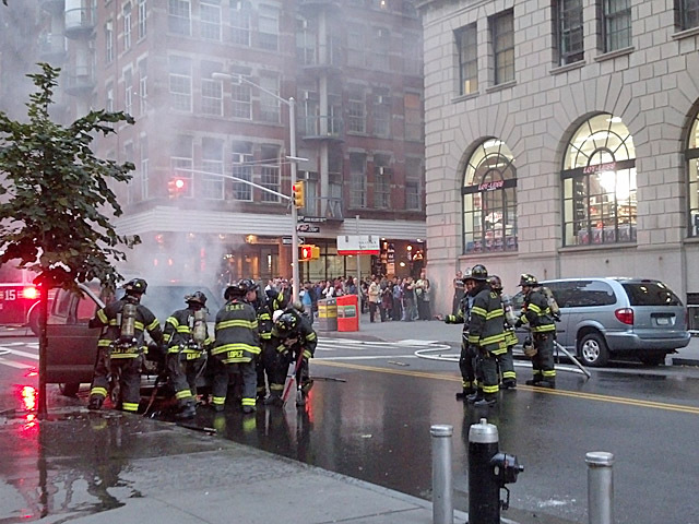 A minivan carting a food cart burst into flames at the corner of Fulton and Gold streets on Sept. 19, 2012. 