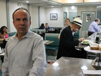 Moonrock Diner owner George Chritis said he can no longer keep his restaurant open 24 hours on weekends because of rowdy clubgoers from Providence NYC next door.