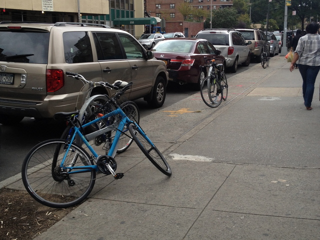 The bike racks outside Pushcart Coffee on East Broadway. 