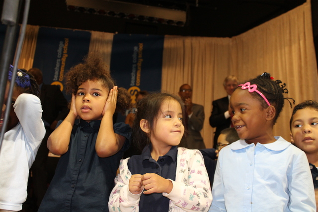 First-graders at Teachers College Community School perform during a welcoming ceremony.