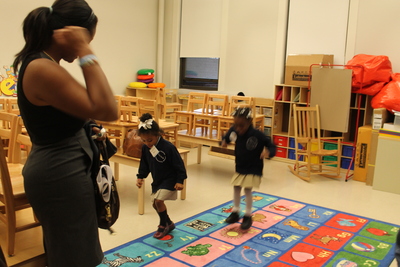 Kids play in their new classrooms at Teachers College Community School.