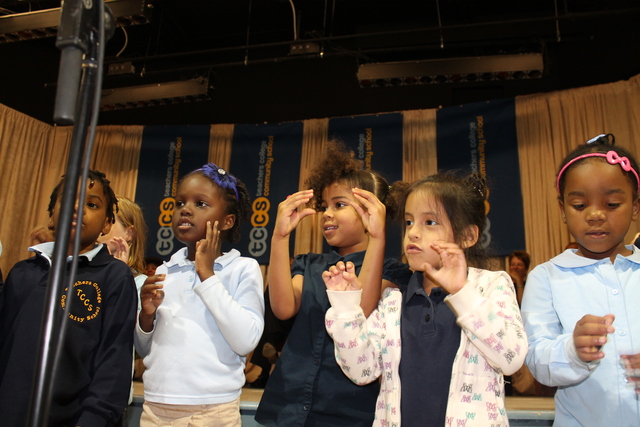 First-graders at Teachers College Community School perform during a welcoming ceremony.