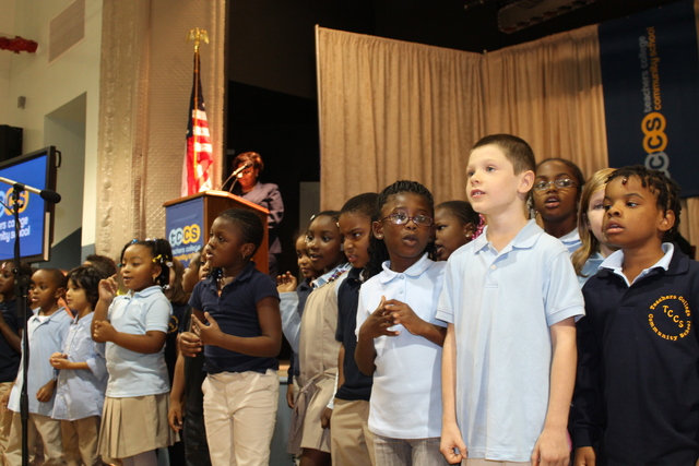 First-graders at Teachers College Community School perform during a welcoming ceremony.