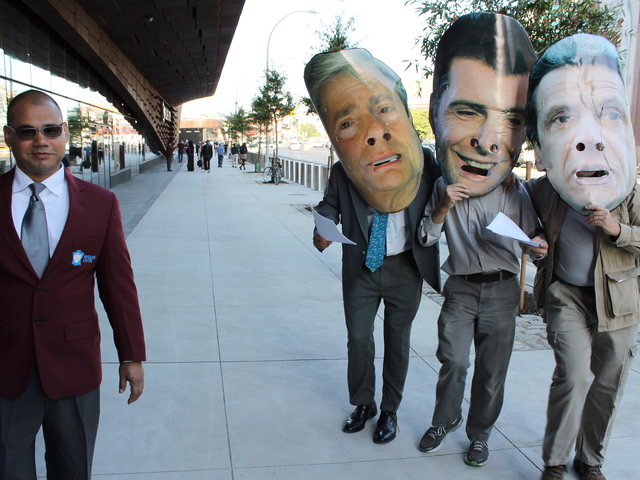 <p>Protesters outside the Barclays Center ribbon cutting wore giant masks of Brooklyn Borough President Marty Markowitz, Nets owner Mikhail Prokhorov and Gov. Andrew Cuomo.</p>
