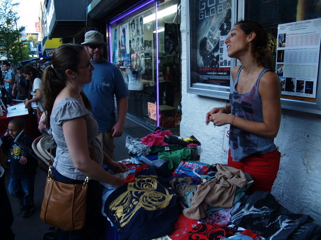 Clothing and art vendors were organized outside the Jackson Heights Cinema by Design For You.