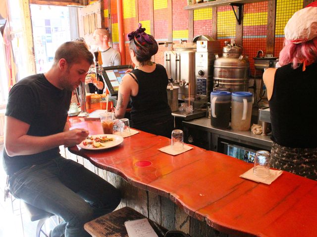 <p>From the bar at Mudspot Cafe you can watch the constant activity of servers as they pull espresso coffee for other patrons at the East Village joint.</p>
