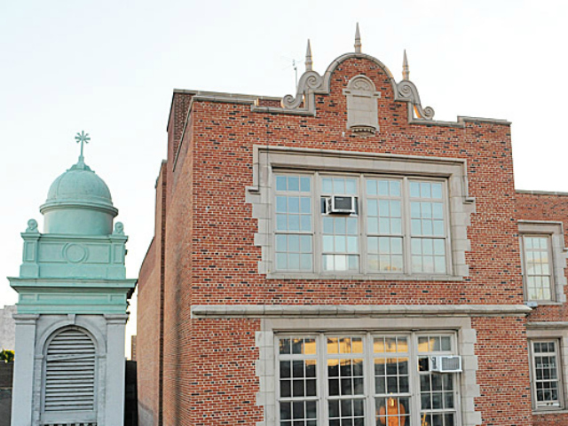 A Department of Education spokeswoman said that structural damage on the eastern wall of the school building at 420 E. 12th St., including a parapet that was apparently coming apart, prompted officials to evacuate children to nearby schools. 