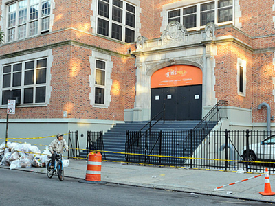 The entrance to the school building at 420 E. 12th St. was taped off on Monday, Sept. 24, 2012, after officials evacuated the building because of structural damage on an exterior wall. 