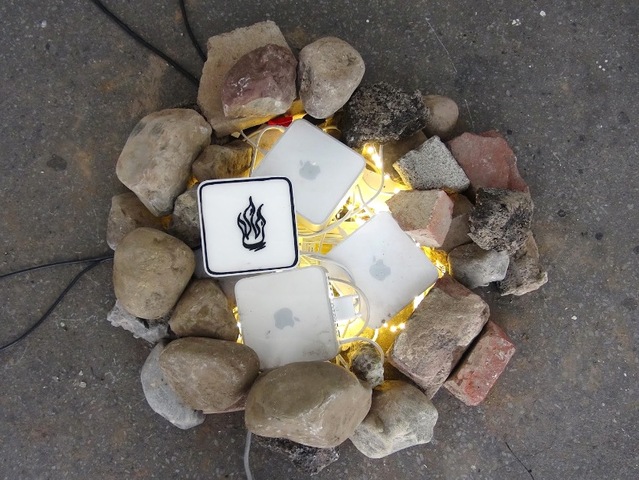 Ecoarttech, an urban campsite project that will participate in the Parsons programming, looks at the overlap between nature and built environments. Here they build a modern campfire.