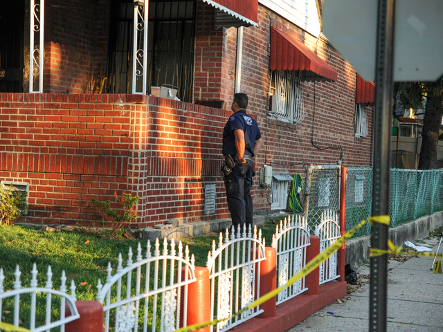 Police search for evidence at the scene of a fatal shooting in Brooklyn on Tuesday September 25th, 2012.
