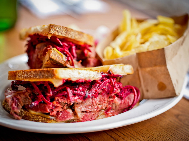 The Braised Brisket Sandwich at Jeffrey's Grocery with red beet and horseradish slaw and Muenster cheese on toasted sourdough.