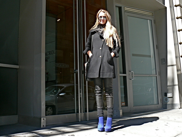 Greta F. in a tailored with leather pants light mesh leggings and blue suade boots 