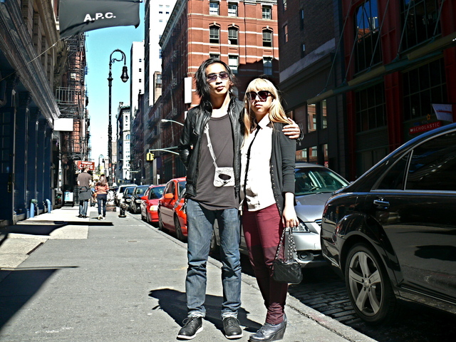 Mike M. and Tuyet N. in in graphic tops paired with leather  and cardigan looks in SoHo