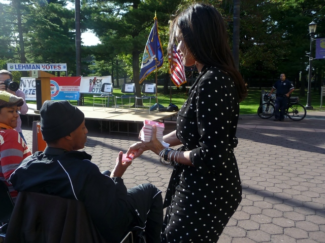 Actress Rosario Dawson handed iTunes gift cards to the crowd before taking the stage at a youth voter registration rally in the Bronx.