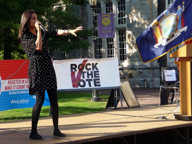 Rosario Dawson speaks to a crowd of students in the Bronx on Tuesday. She urged the group to register to vote, and to get 15 of their friends and family members to register, too.