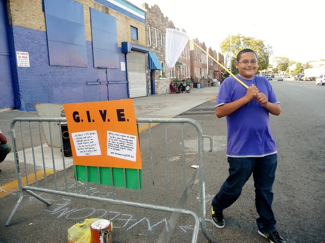 Park(ing) Day is a movement where residents convert parking spots into temporary public park spaces. G.I.V.E, a neighborhood group in Parkchester, was behind one of Friday's sites in the Bronx.