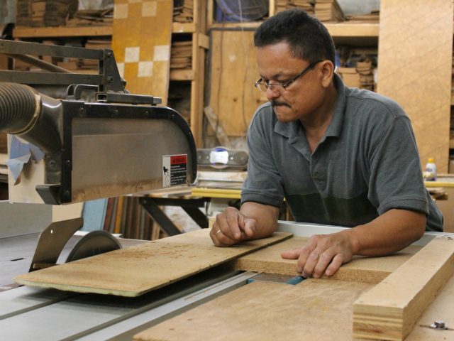 A worker at Globus Cork, a colored cork tile factory based in The Bronx.